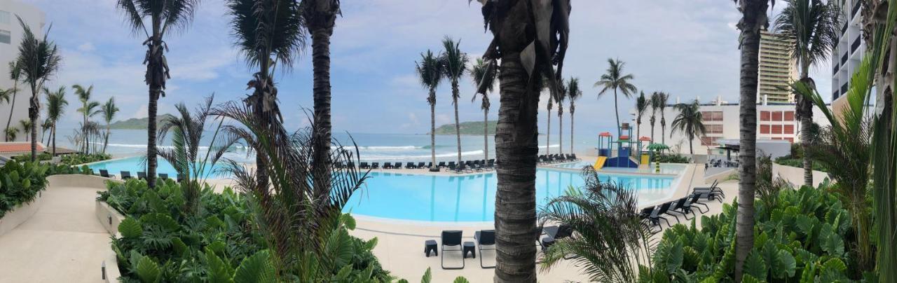 Viaggio Resort Mazatlán Exterior foto View of the beach at the Grand Palladium Hotel